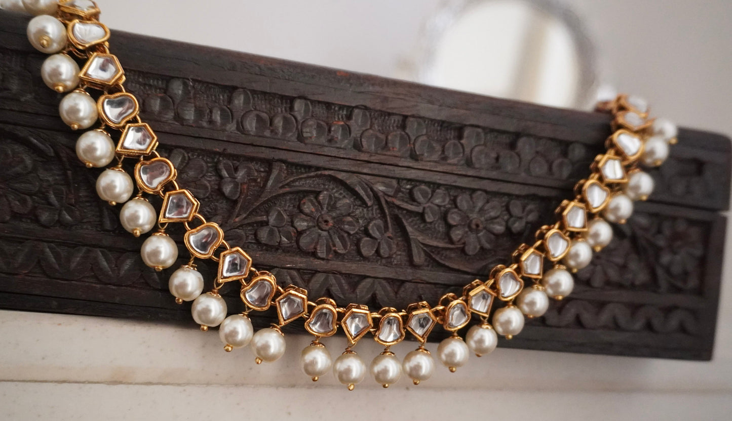 Anika Pearl White Kundan Necklace (Necklace, Earrings Maang Tikka - Set of 3)